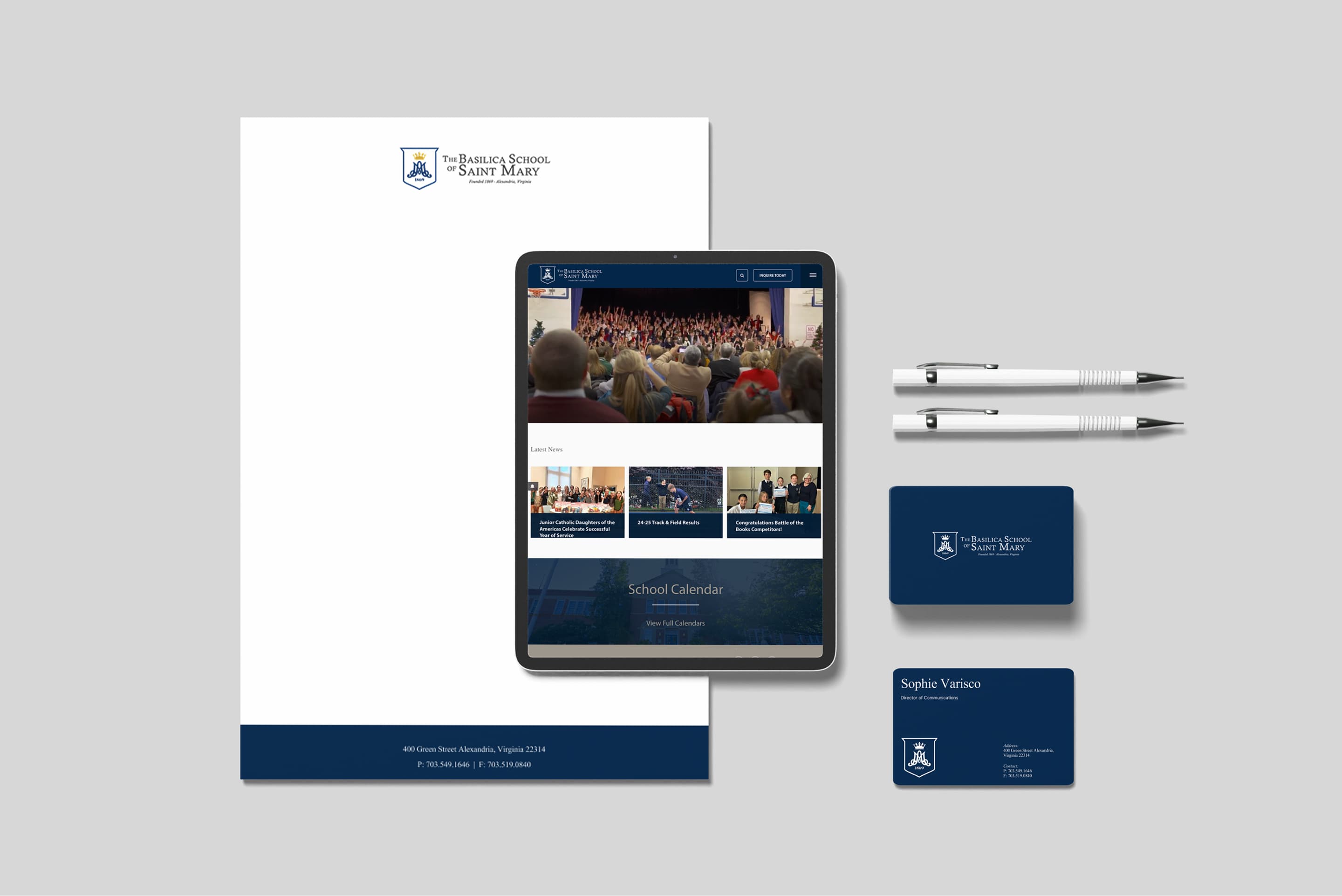 Basilica School branding materials – laptop, stationery, and documents