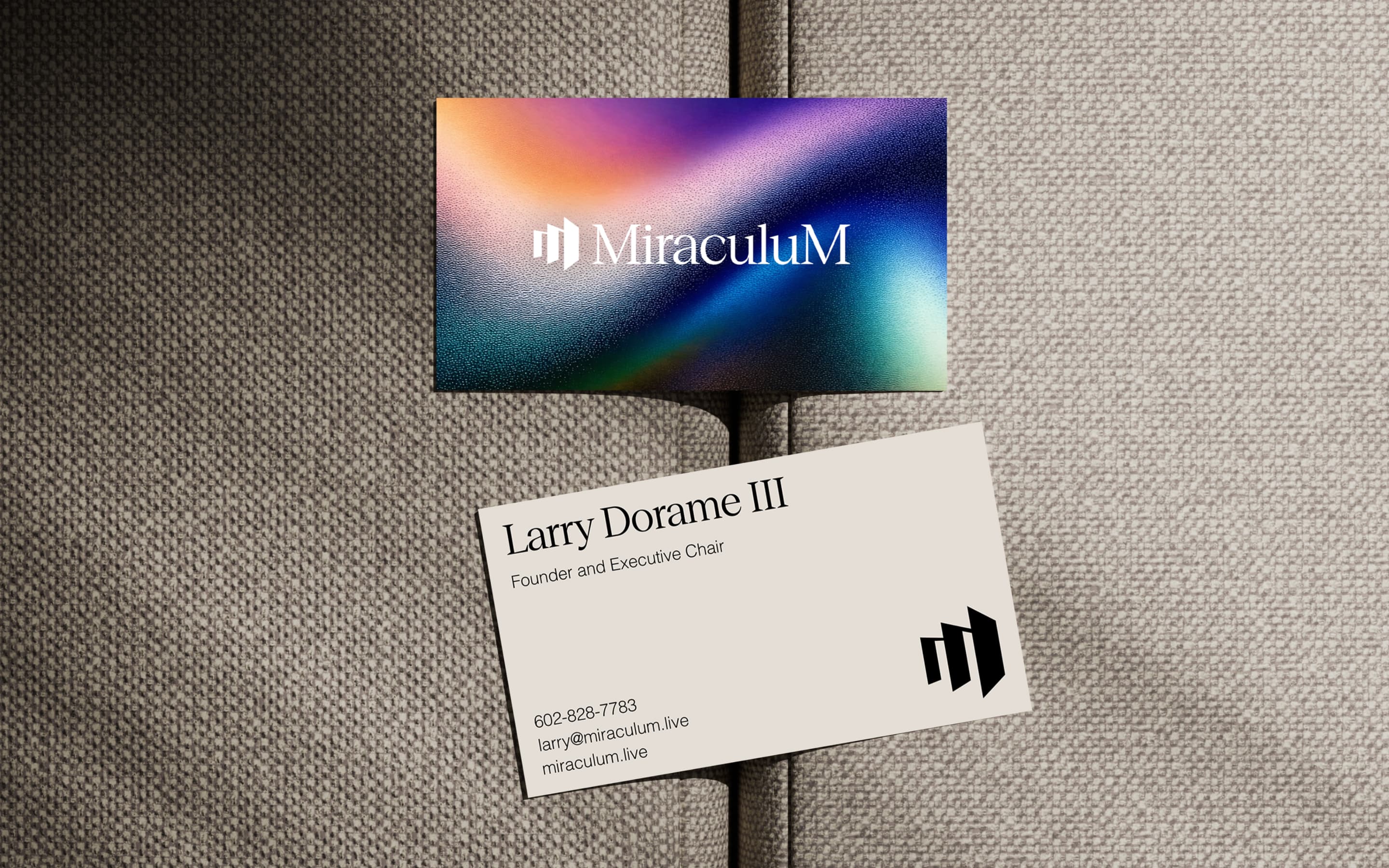 Miraculum business card and logo card mockup on textured fabric